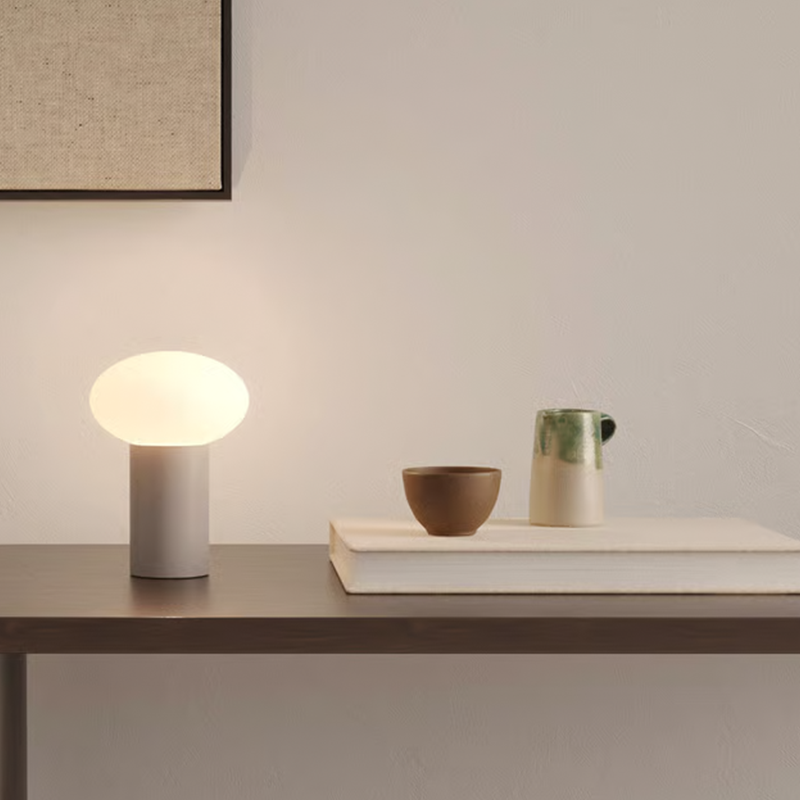 The Zeppo Portable Lamp from Astro Lighting in pebble grey in an entryway.