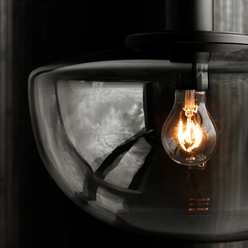 The Bank Pendant from Audo Copenhagen turned on.