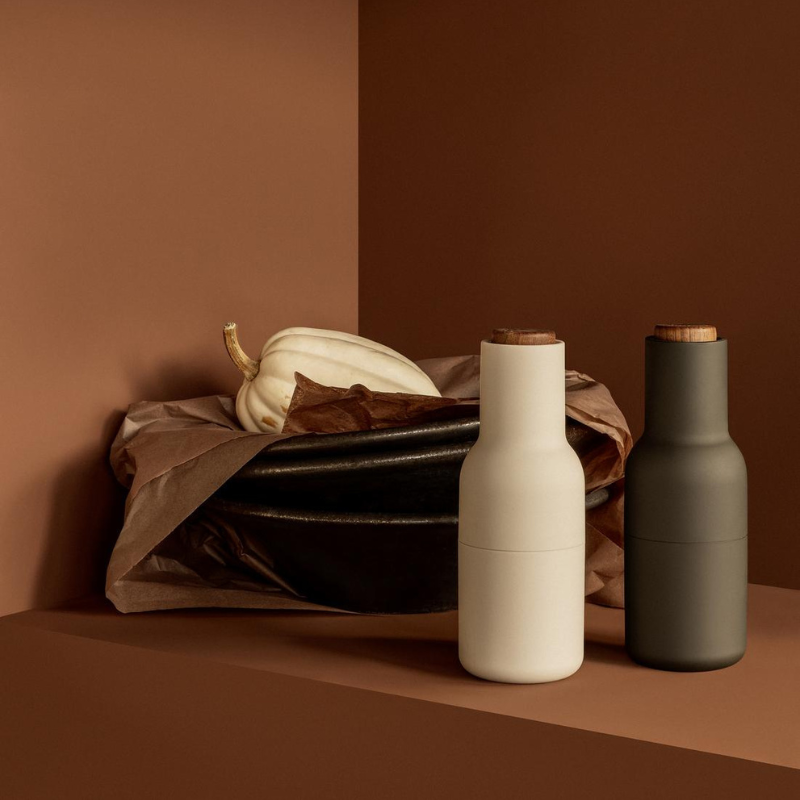 The Bottle Grinder from Audo Copenhagen in a dining setting.