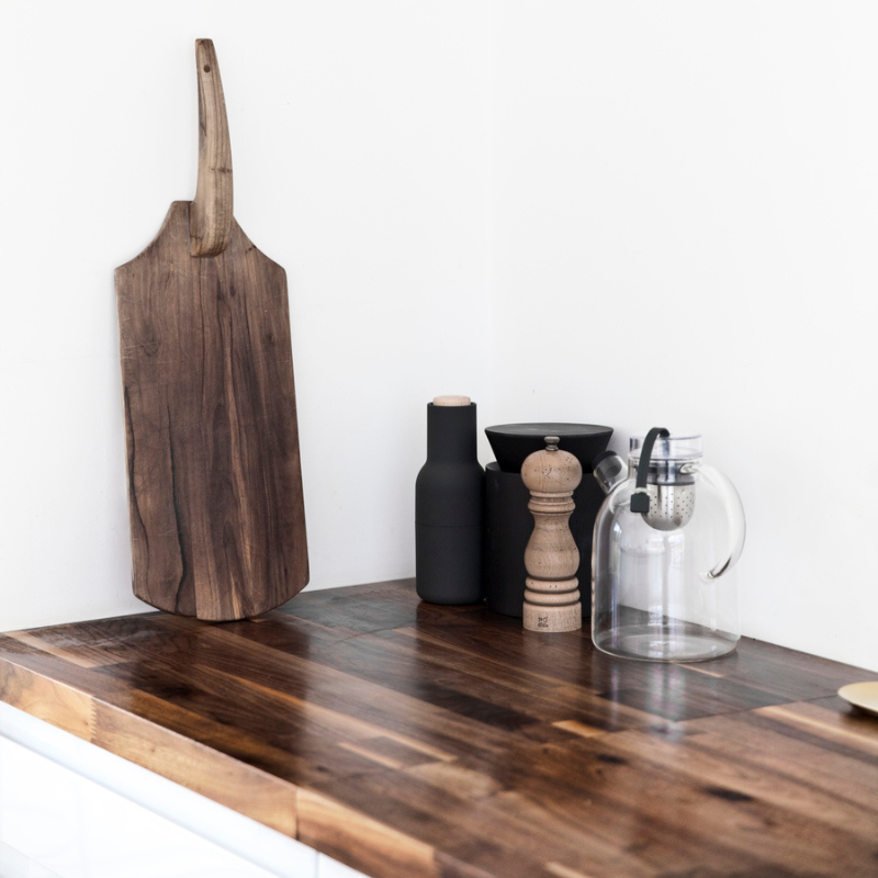 The Bottle Grinder from Audo Copenhagen in a kitchen and dining setting.