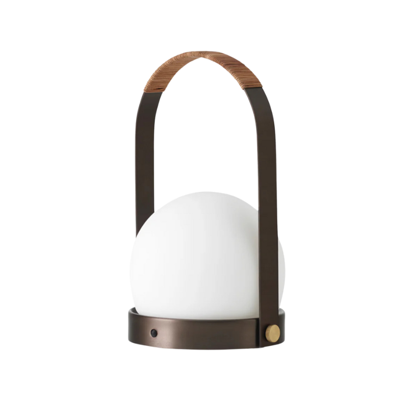 The Carrie Portable LED Lamp from Audo Copenhagen in bronzed brass.