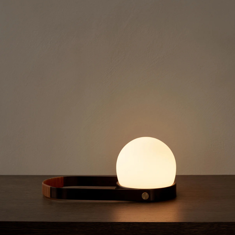 The Carrie Portable LED Lamp from Audo Copenhagen in a family area.