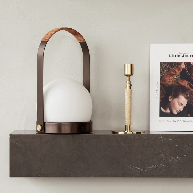 The Carrie Portable LED Lamp from Audo Copenhagen in a living room.