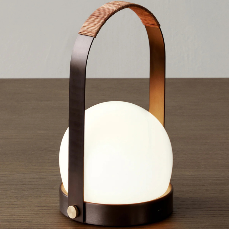 The Carrie Portable LED Lamp from Audo Copenhagen in a lounge.