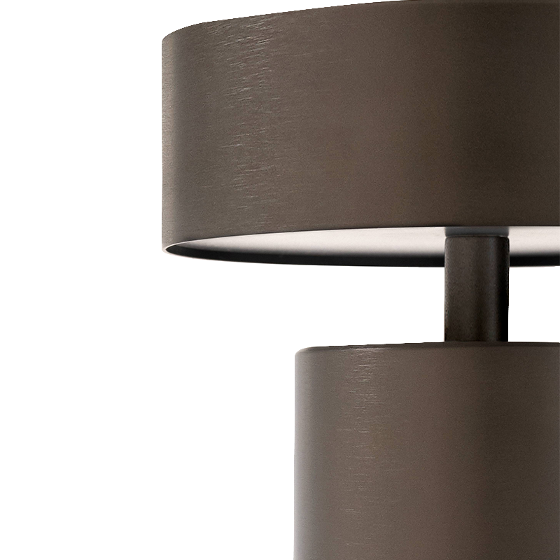 The Column Portable Table Lamp from Audo Copenhagen in anodized aluminum in close-up.