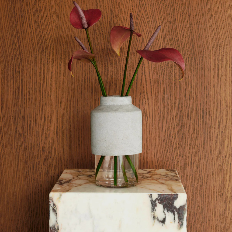 The Cubic Marble Plinth from Audo Copenhagen used as a display stand.