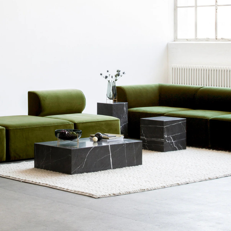 The Cubic Marble Plinth from Audo Copenhagen in a lounge.