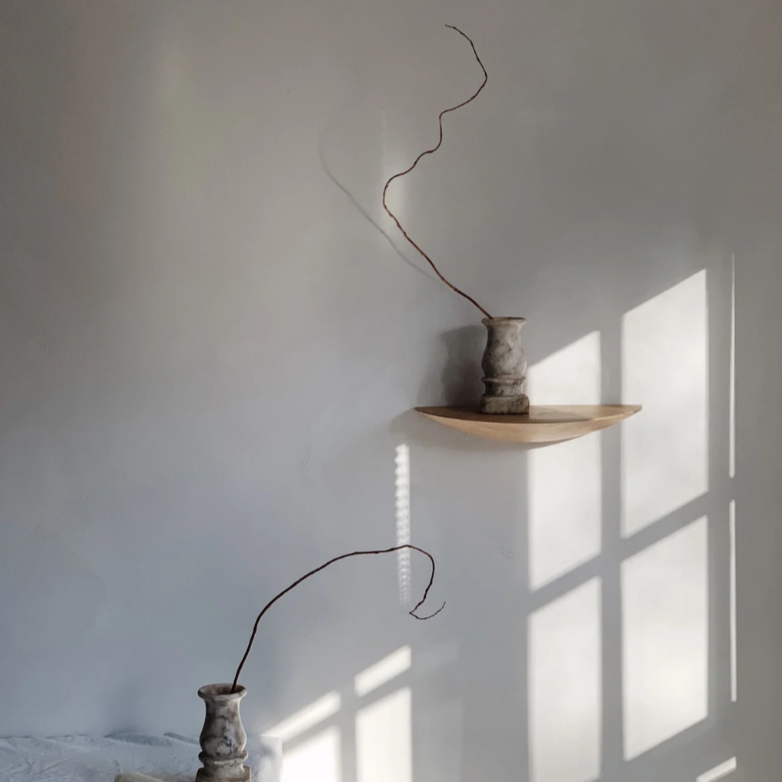 The Gridy Fungi Shelf from Audo Copenhagen in oak in a medium size on the wall of an office.