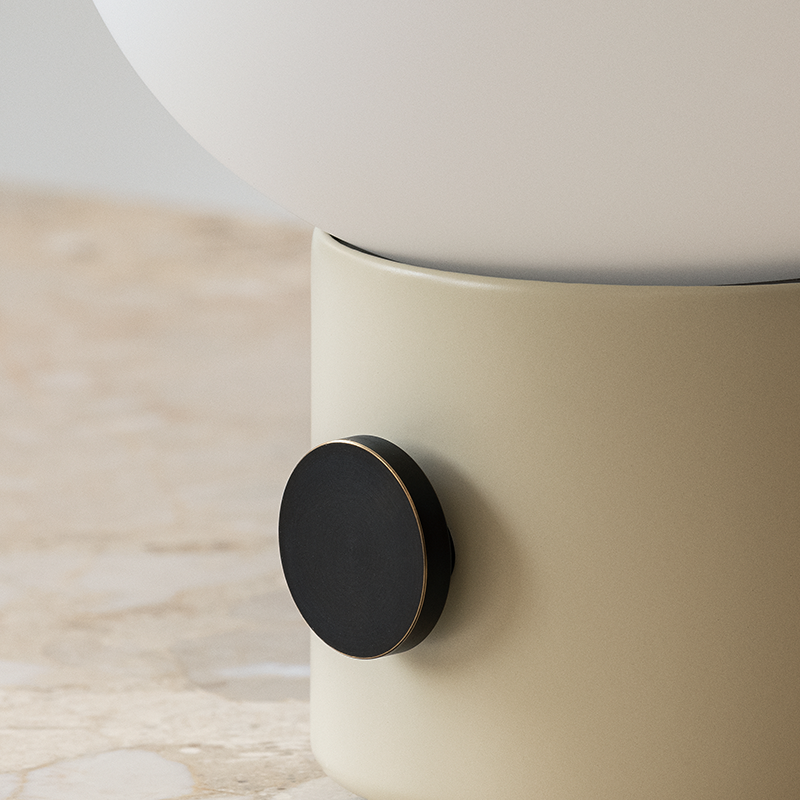 The JWDA Portable Table Lamp from Audo Copenhagen in alabaster white, focusing on the switch.