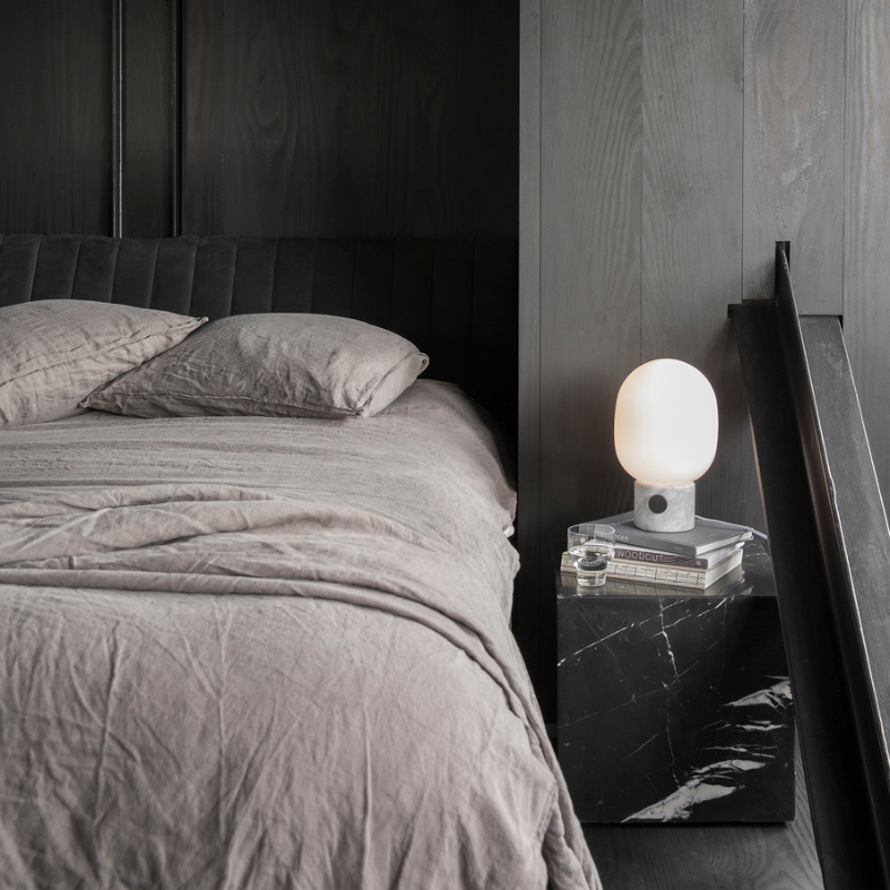 The JWDA Table Lamp from Audo Copenhagen in a bedroom.