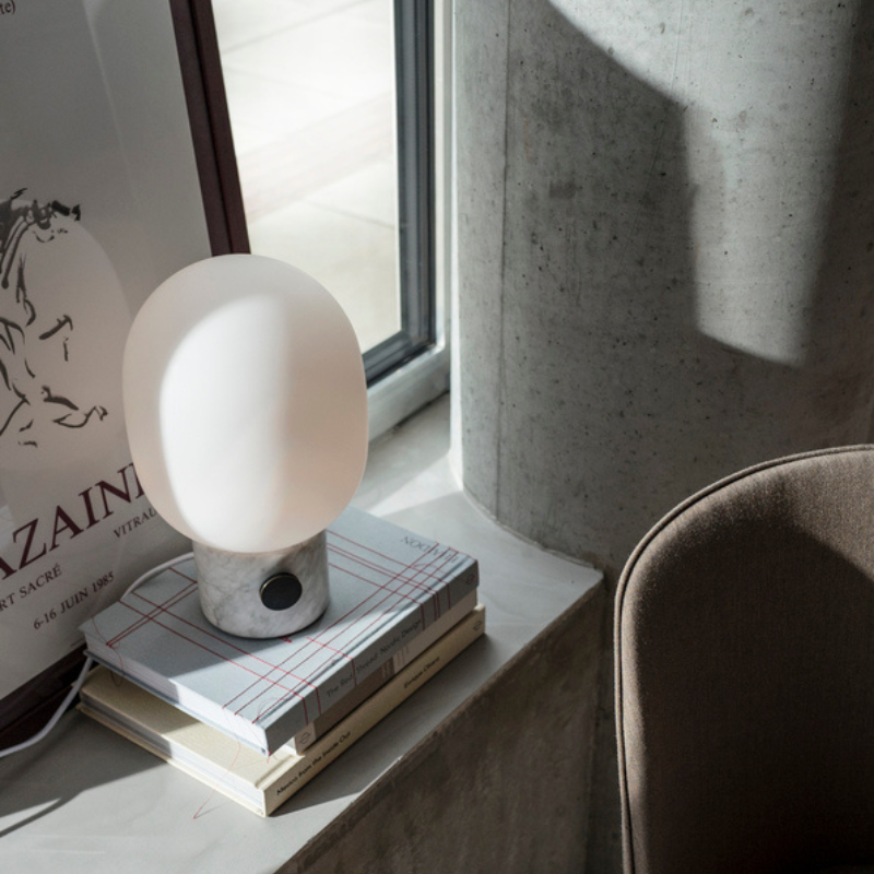 The JWDA Table Lamp from Audo Copenhagen on a windowsill.