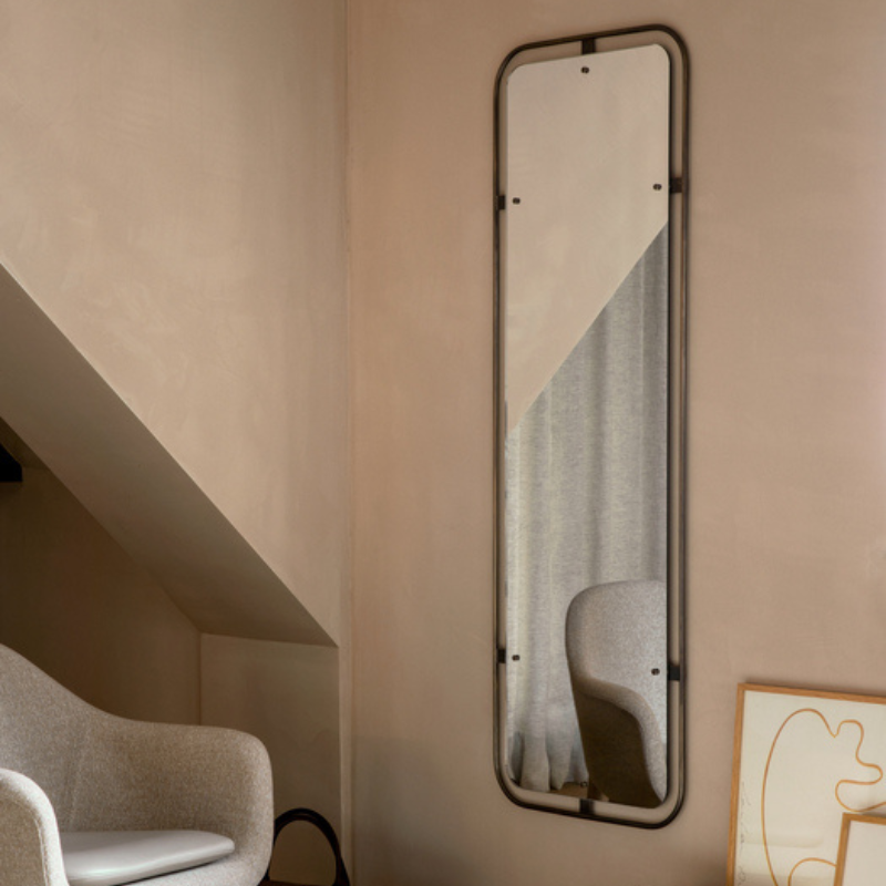 The Rectangular Nimbus Mirror from Audo Copenhagen in a living room.
