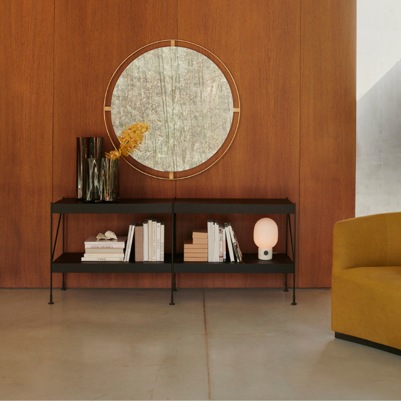 The Round Nimbus Mirror from Audo Copenhagen in a living space.