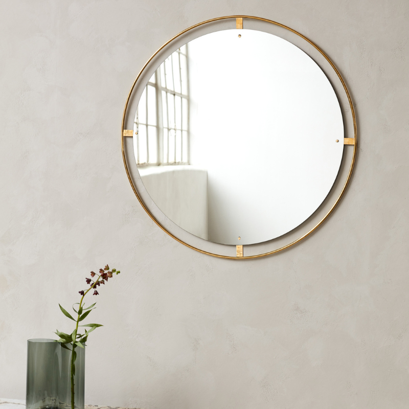 The Round Nimbus Mirror from Audo Copenhagen in a lounge.