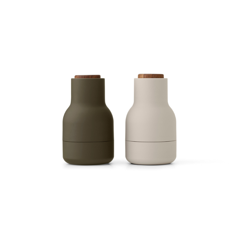 The Small Bottle Grinder from Audo Copenhagen in hunting green and beige with walnut lid.
