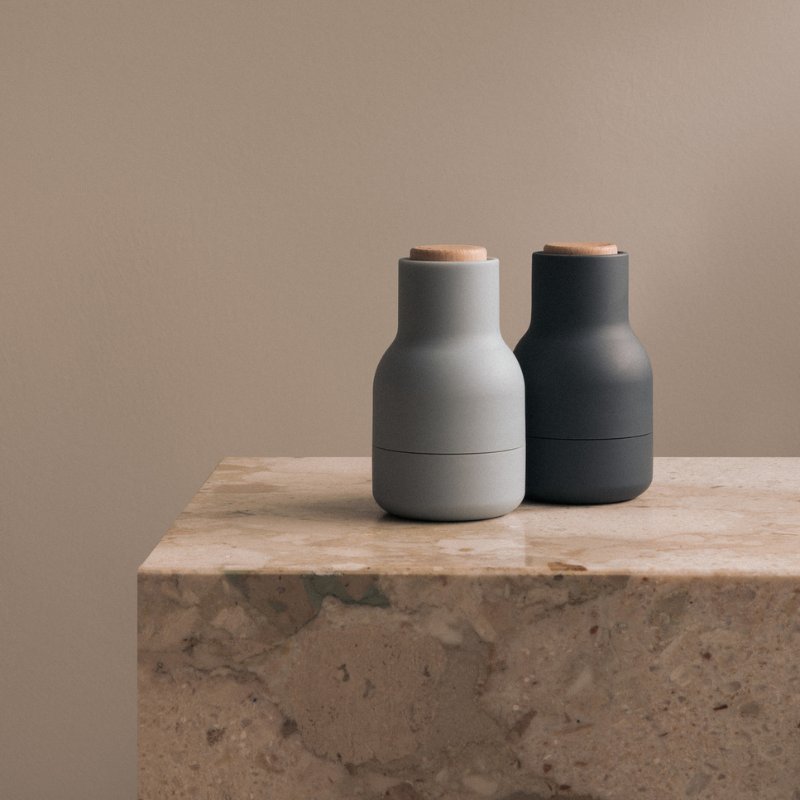 The Small Bottle Grinder from Audo Copenhagen in a living room.