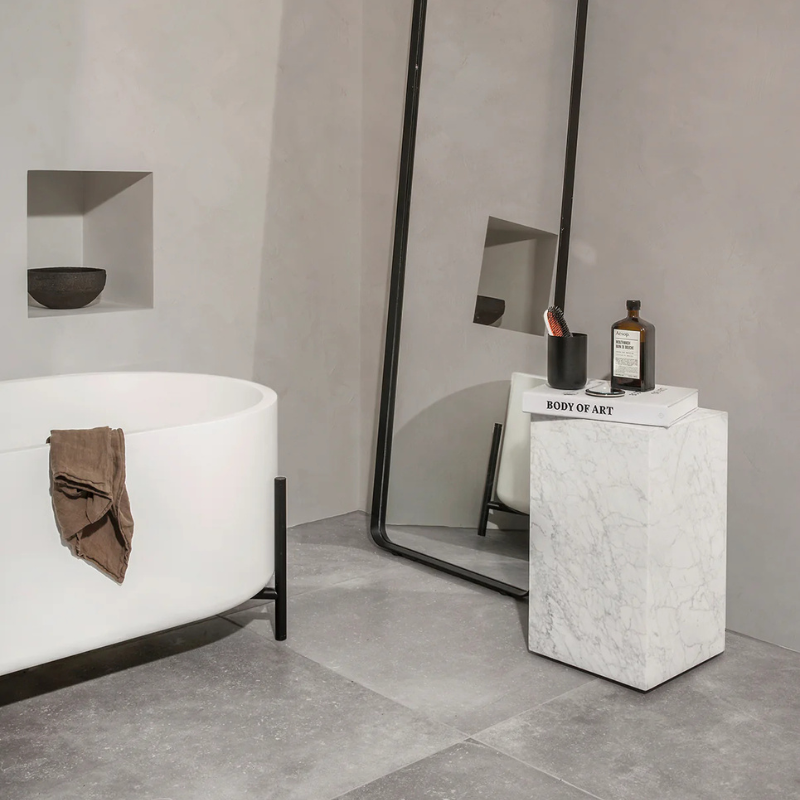 The Tall Marble Plinth from Audo Copenhagen in a bathroom.