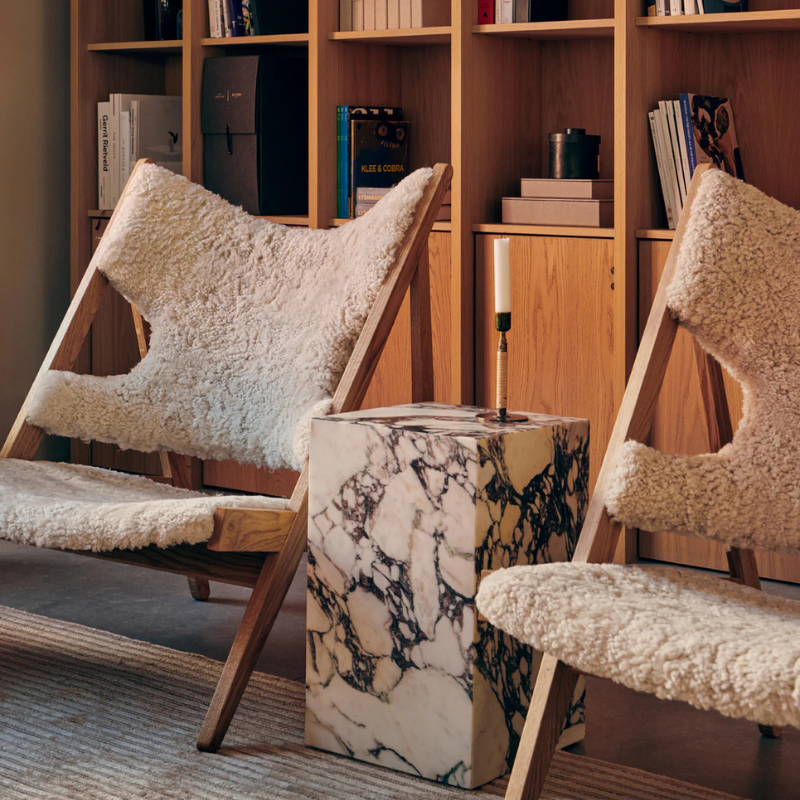 The Tall Marble Plinth from Audo Copenhagen in a living room.