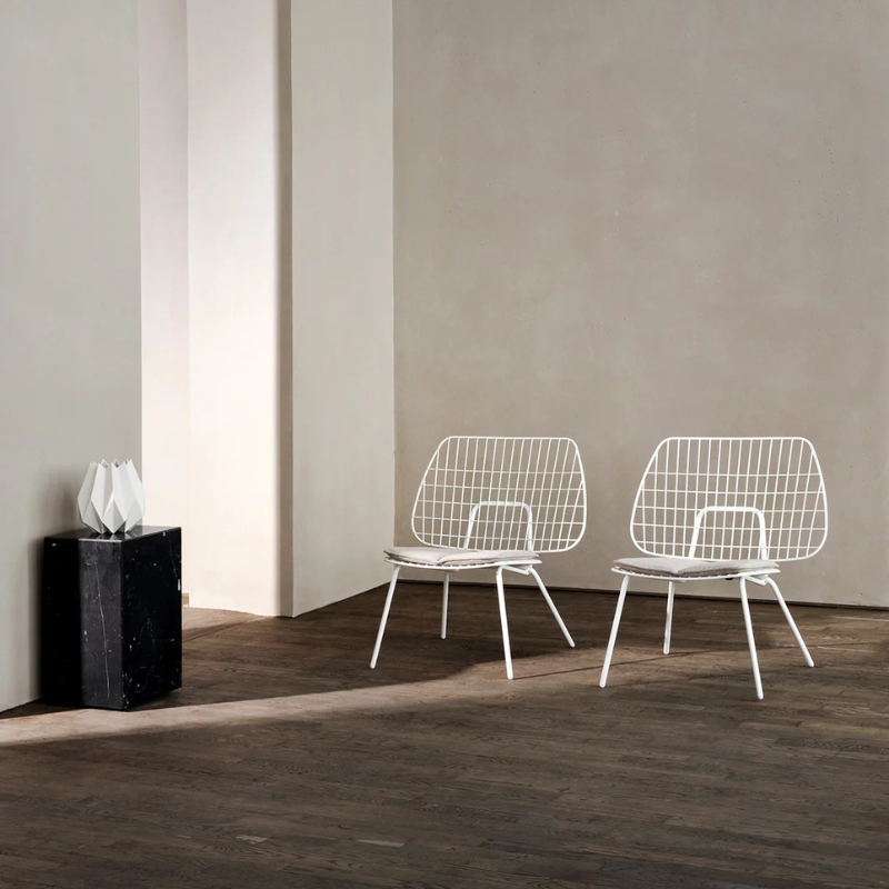 The Tall Marble Plinth from Audo Copenhagen in an open space.