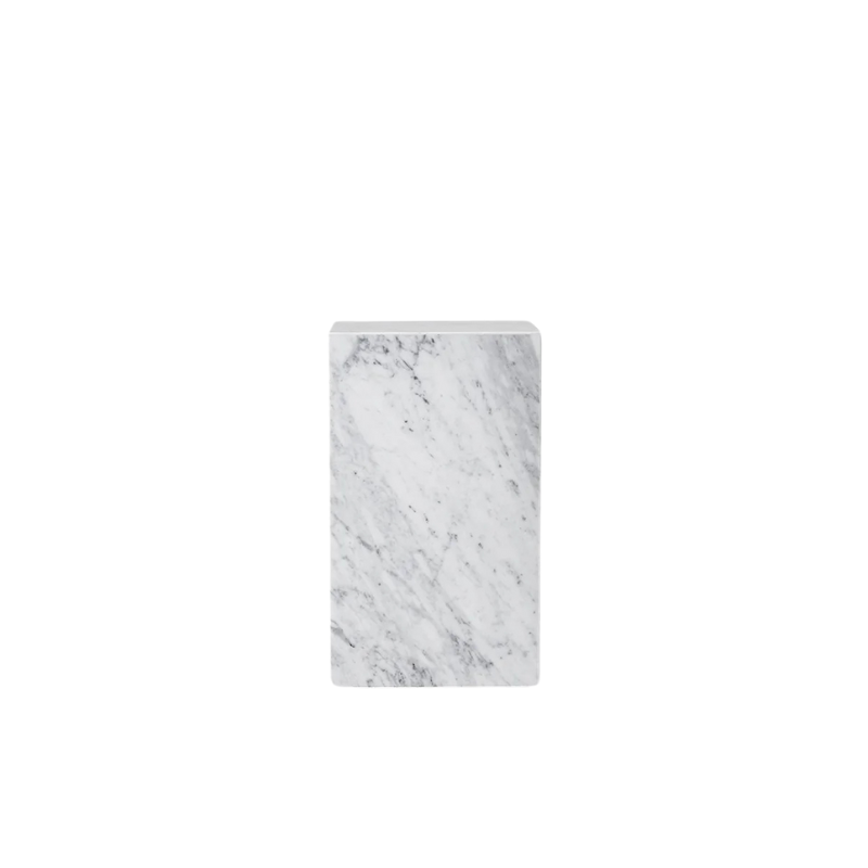 The Tall Marble Plinth from Audo Copenhagen made from white carrara marble.