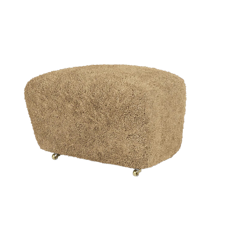 The Tired Man Sheepskin Ottoman from Audo Copenhagen in honey with natural oak legs.