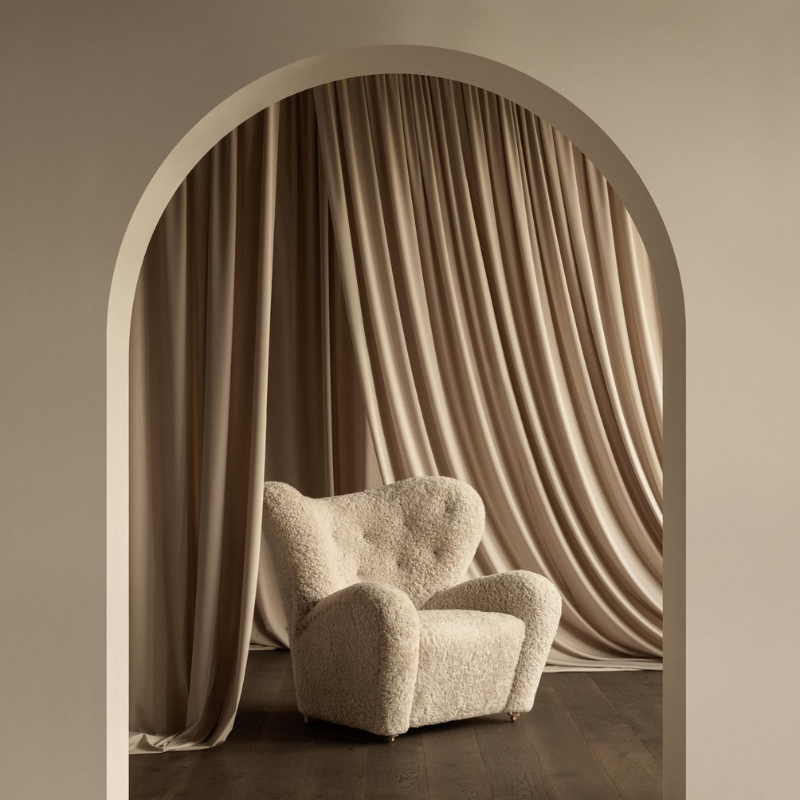 The Tired Man Sheepskin Lounge Chair from Audo Copenhagen in a home.