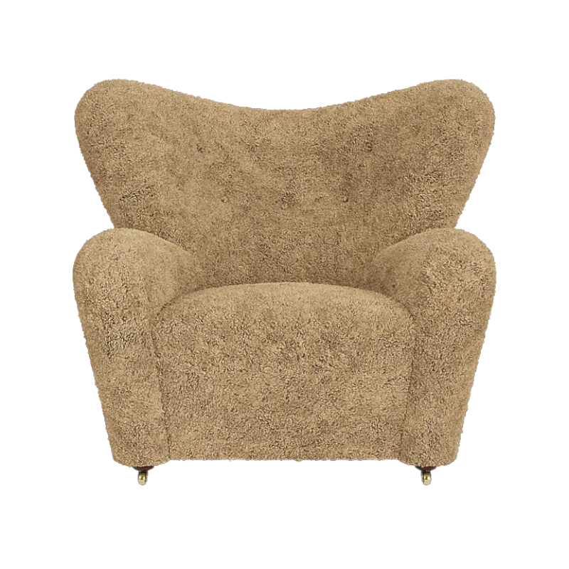 The Tired Man Sheepskin Lounge Chair from Audo Copenhagen in honey with dark stained oak legs from the front.