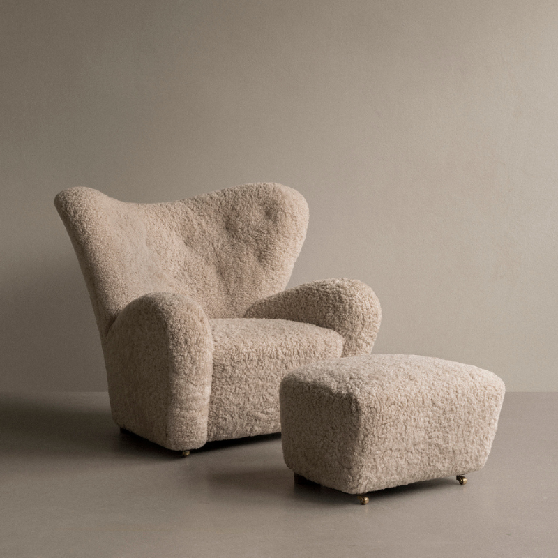 The Tired Man Sheepskin Ottoman from Audo Copenhagen with The Tired Man Sheepskin Lounge Chair.
