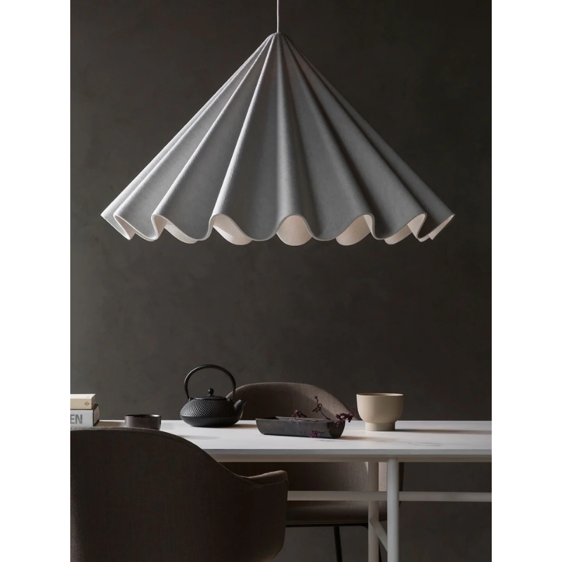 Pleated felt shade pendant light. The Dancing Pendant by Audo CPH in the size large over a dining room table.
