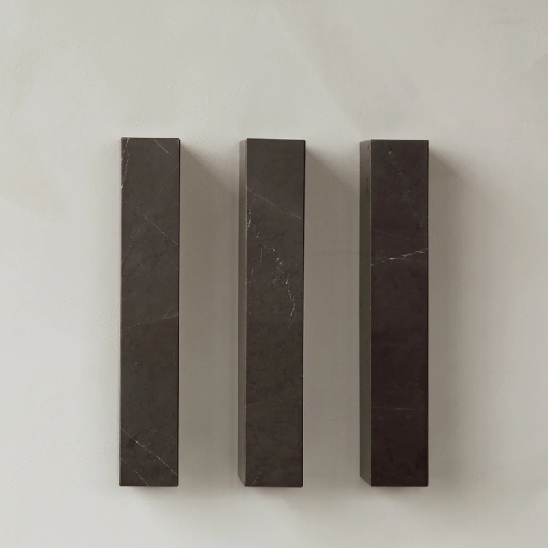 Marble floating shelf in grey by Audo Copenhagen vertically installed