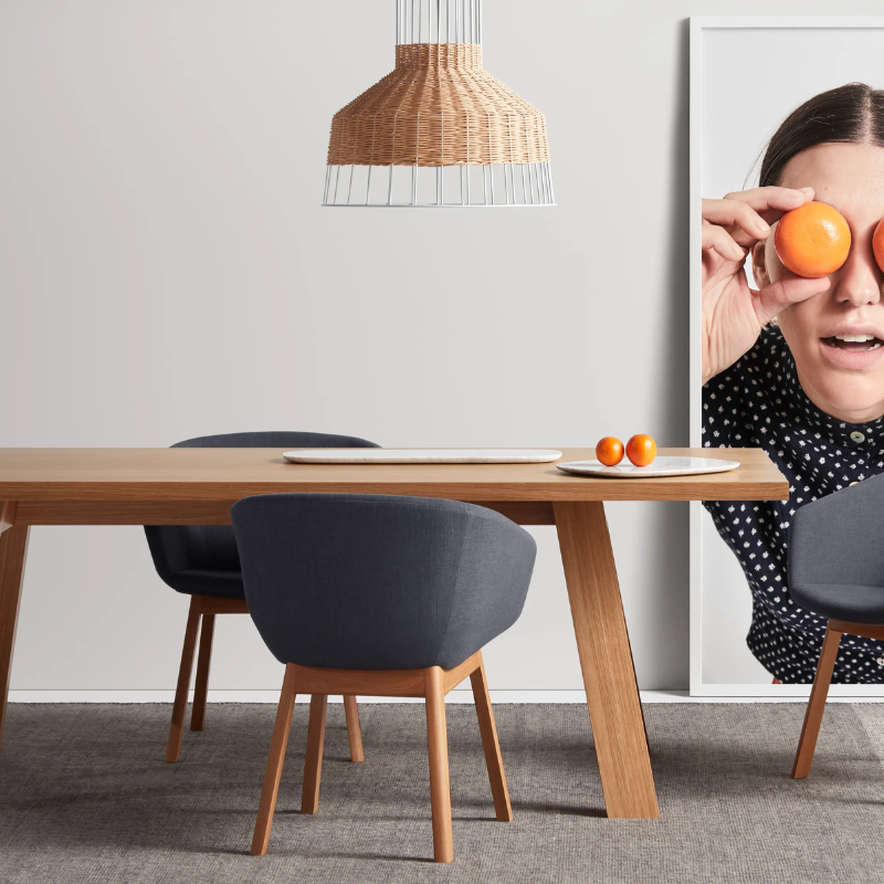 The A Walk in the Park Dining Table from Blu Dot in walnut in a dining room.