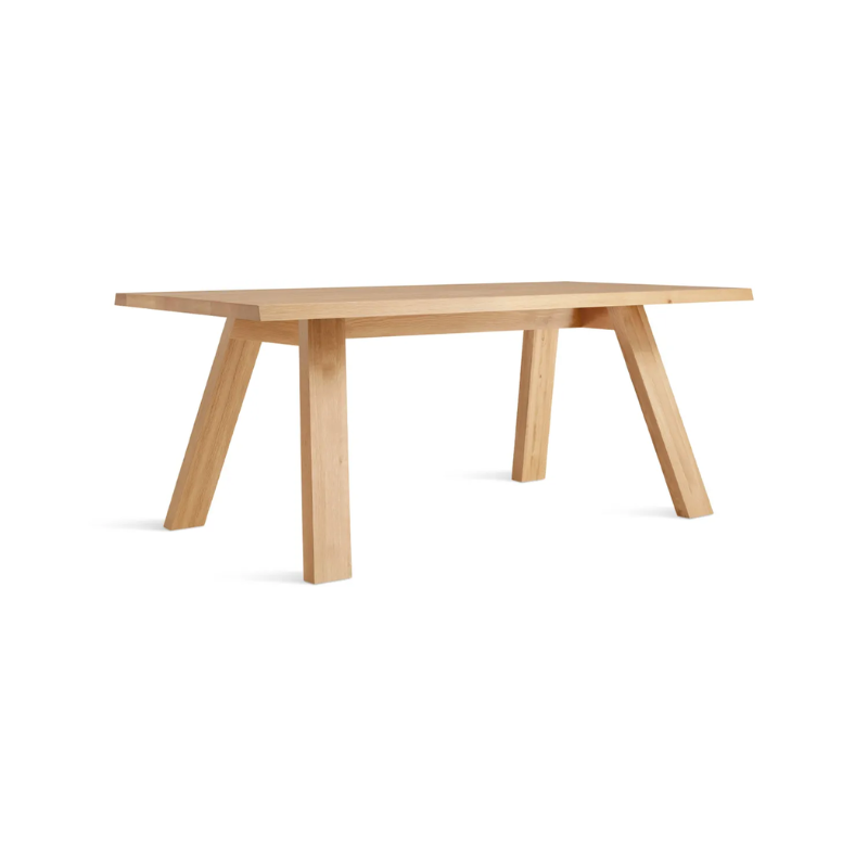 The 72 inch A Walk in the Park Dining Table from Blu Dot in white oak from an angle.