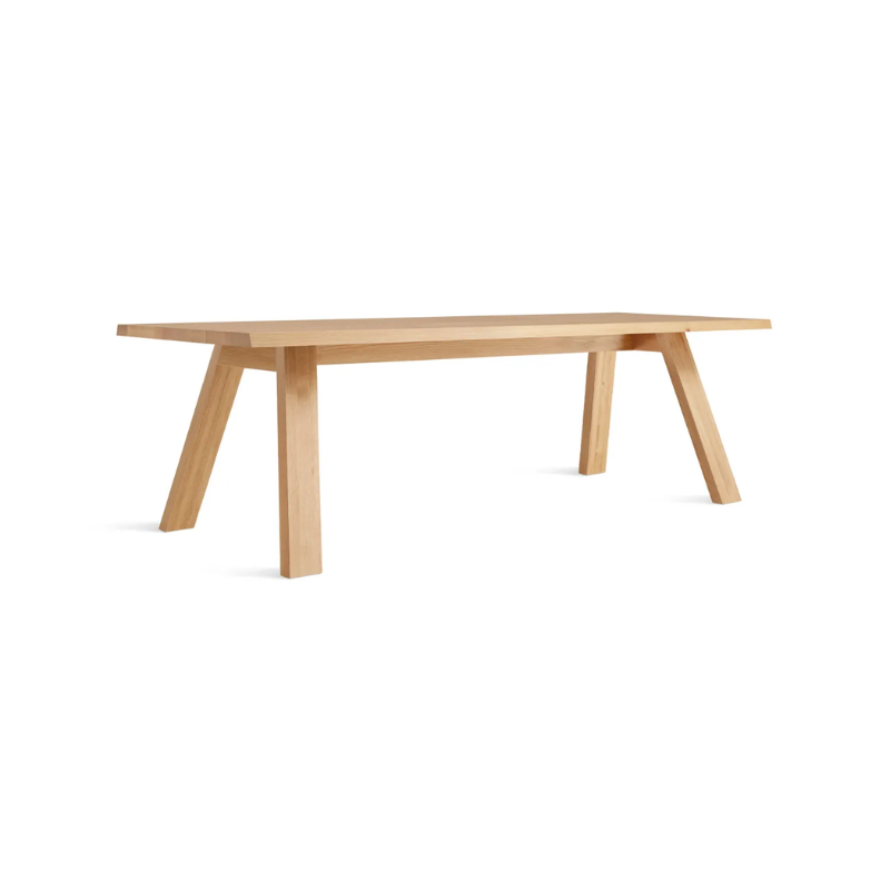 The 90 inch A Walk in the Park Dining Table from Blu Dot in white oak from an angle.