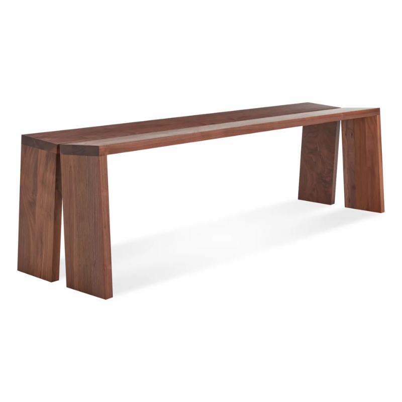 The Amicable Split 60" Bench from Blu Dot in walnut from an angle.