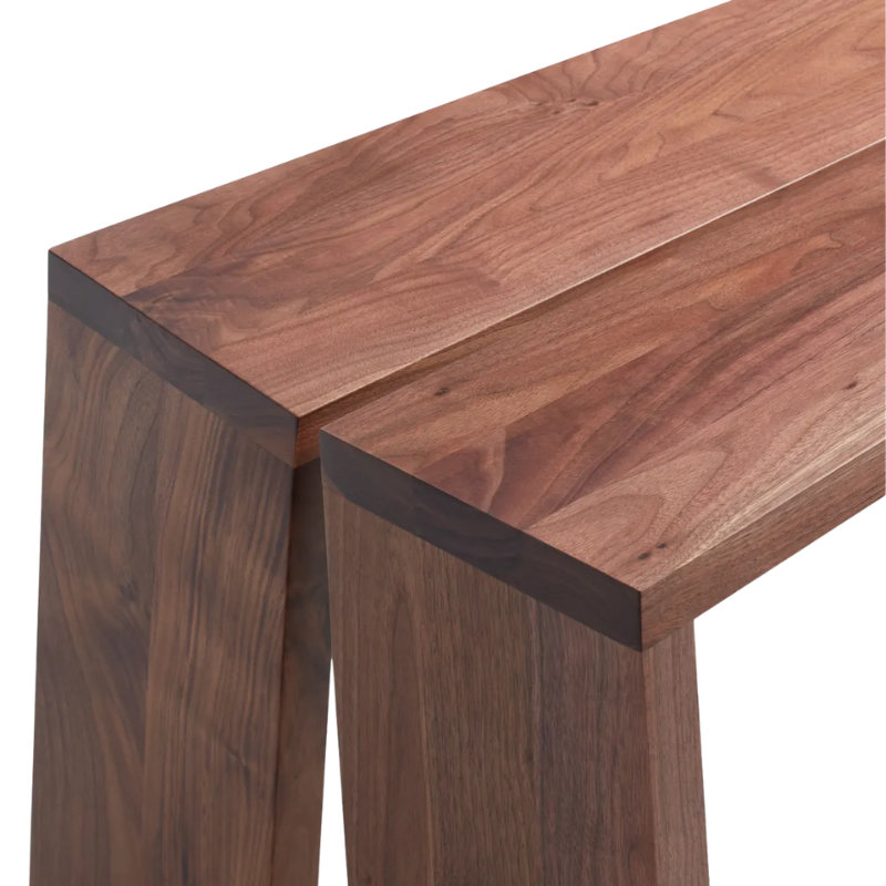 The Amicable Split 60" Bench from Blu Dot in walnut close up.