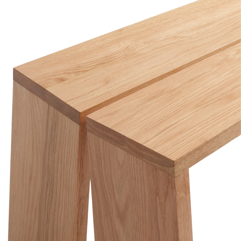 The Amicable Split 60" Bench from Blu Dot in white oak close up.