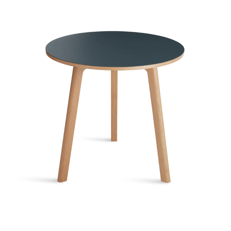 The 30 inch Apt Café Table from Blu Dot with navy green table top and white oak body from a high angle.