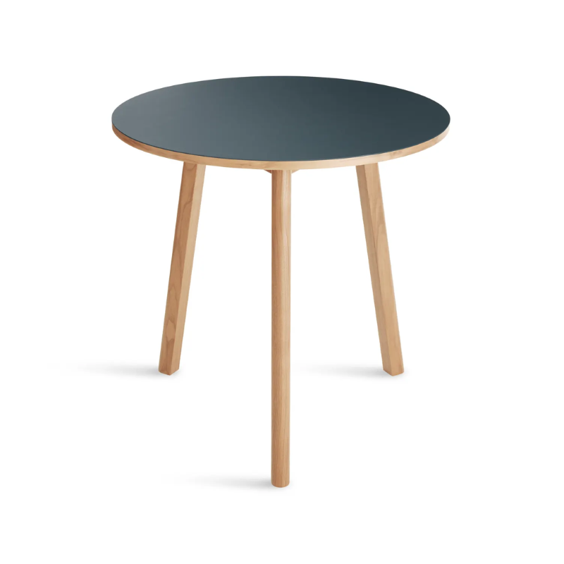 The 30 inch Apt Café Table from Blu Dot with navy green table top and white oak body in a view from the top.