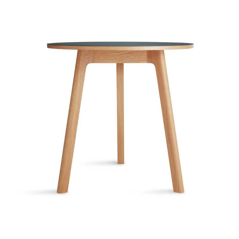 The 30 inch Apt Café Table from Blu Dot with navy green table top and white oak body.