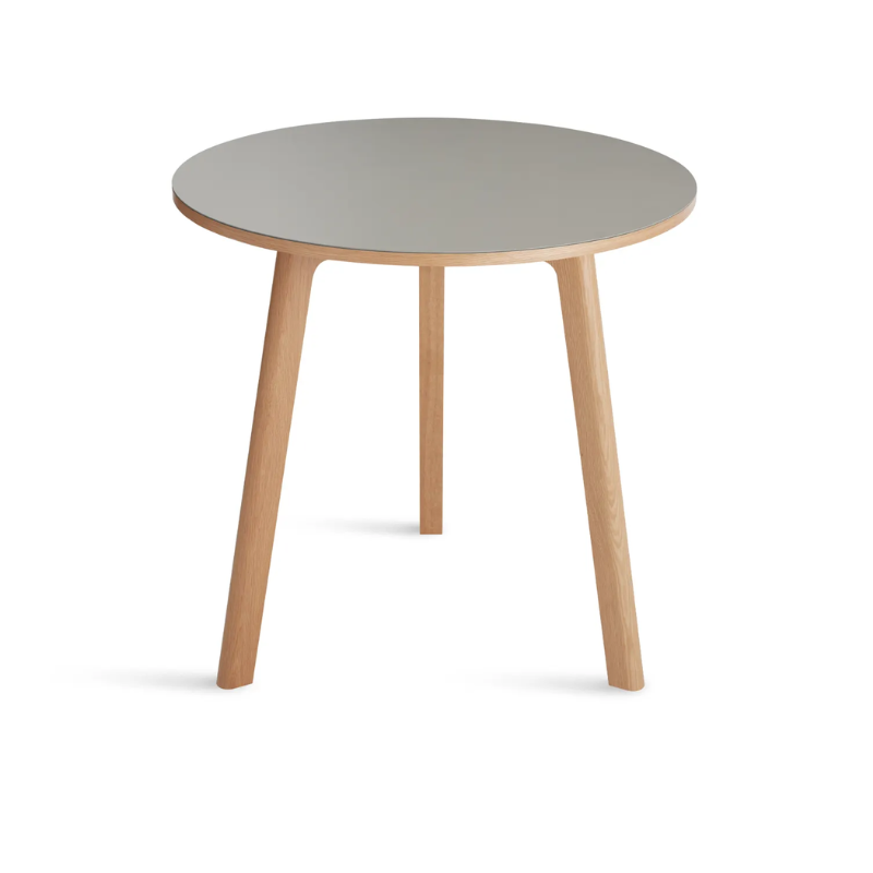 The 30 inch Apt Café Table from Blu Dot with putty table top and white oak body from an angle.