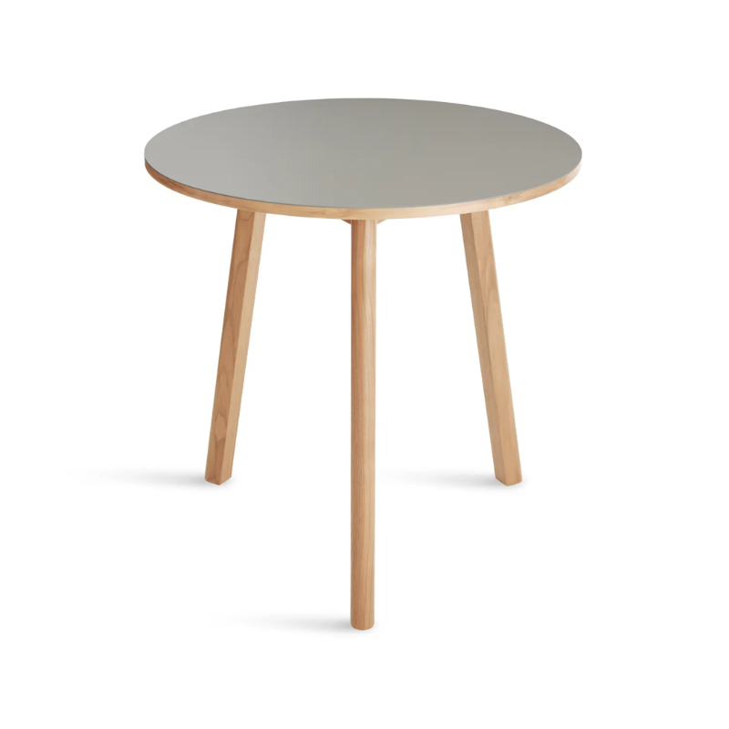 The 30 inch Apt Café Table from Blu Dot with putty table top and white oak body from a high angle.