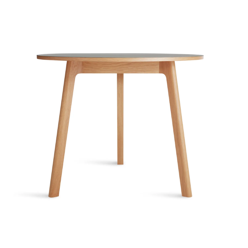 The 36 inch Apt Café Table from Blu Dot with putty table top and white oak body.