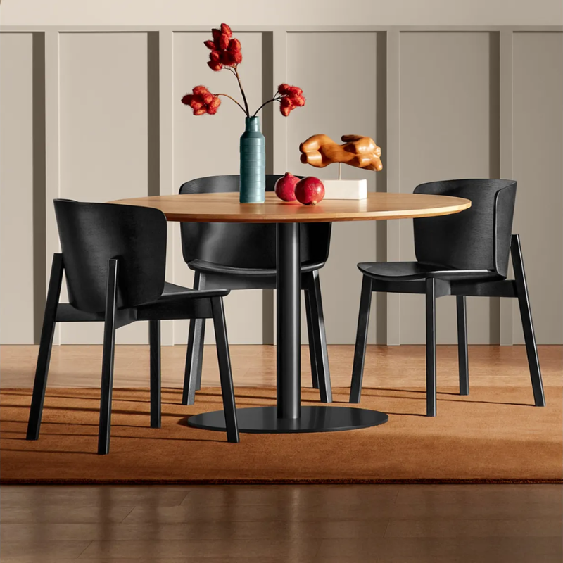 The Buddy Chair from Blu Dot in black on ash in a dining room.