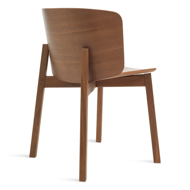 The Buddy Chair from Blu Dot in walnut from the back at an angle.