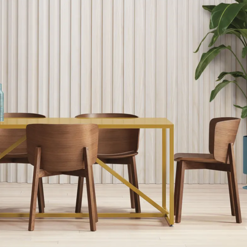 The Buddy Chair from Blu Dot in walnut in a family room.