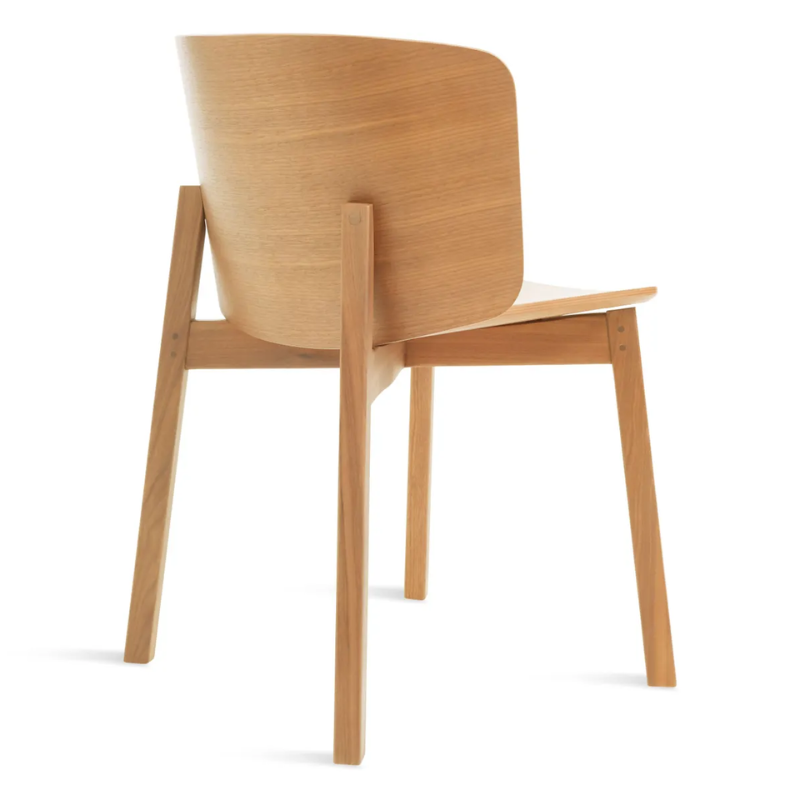 The Buddy Chair from Blu Dot in white oak from the back at an angle.