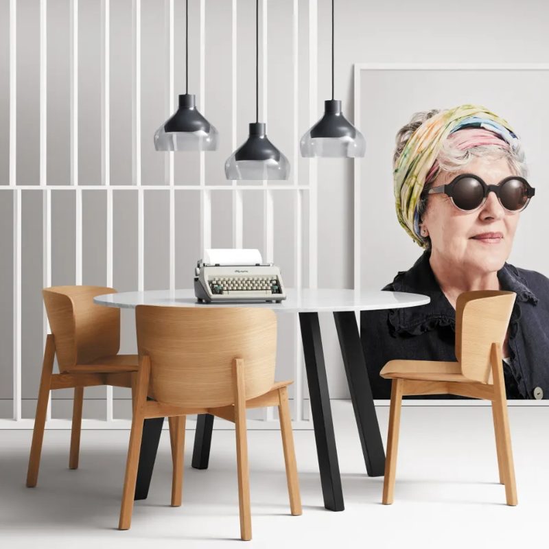 The Buddy Chair from Blu Dot in white oak in a living space.