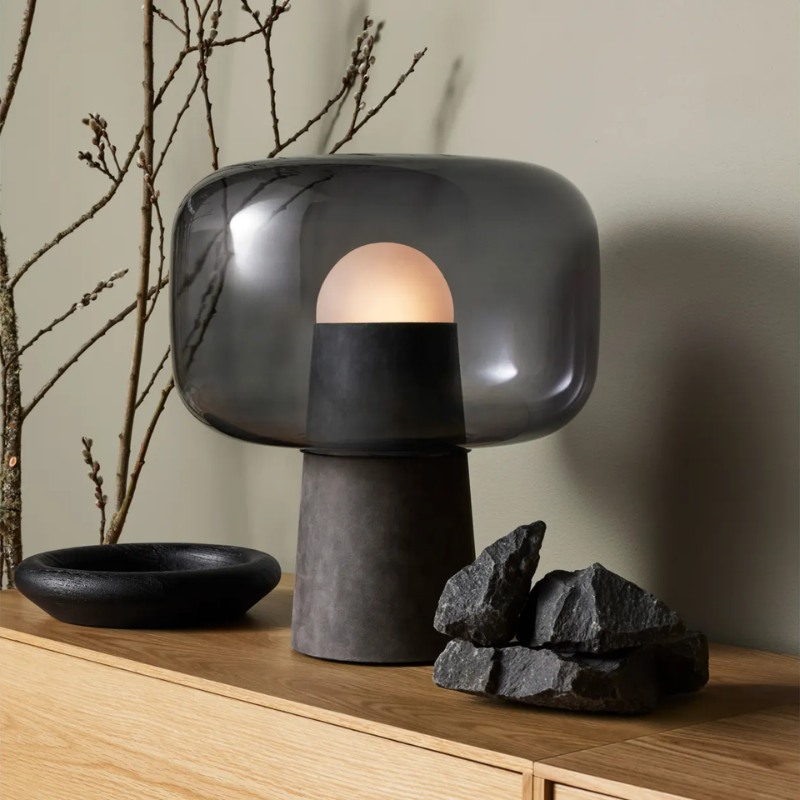 The Bully Table Lamp from Blu Dot in a living room.