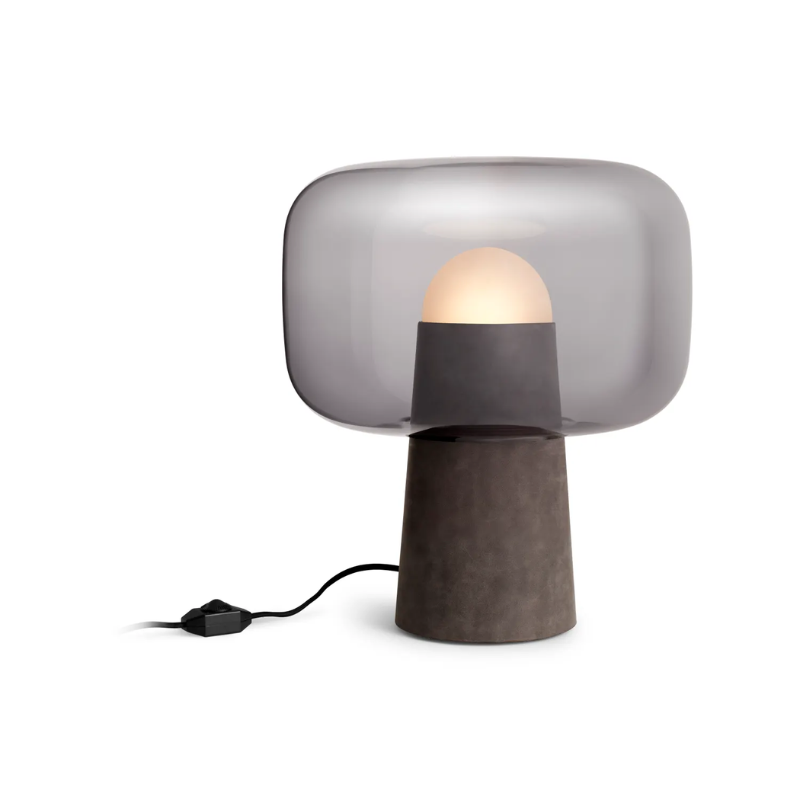 The Bully Table Lamp from Blu Dot turned on.