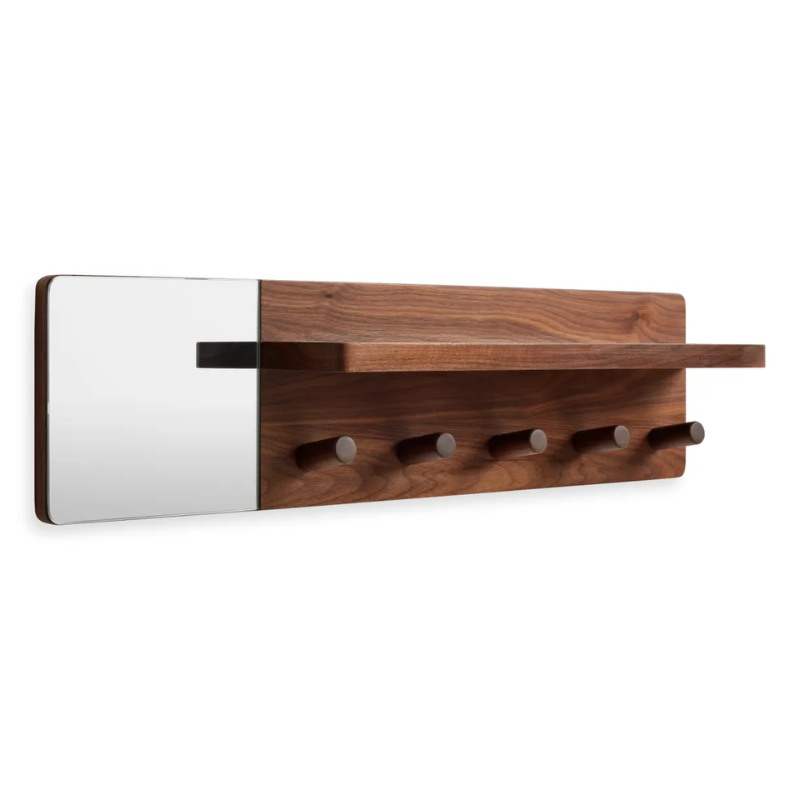The Candid Wall Shelf with Hooks from Blu Dot in walnut from an angle.